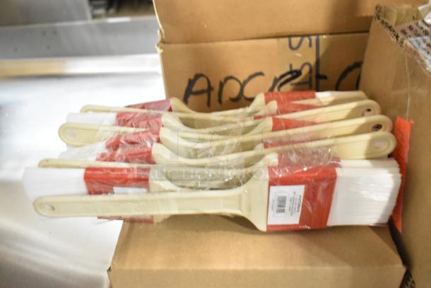 Eight brand new Choice 2"W polyester bristle pastry brushes with plastic handles, wrapped in packaging.