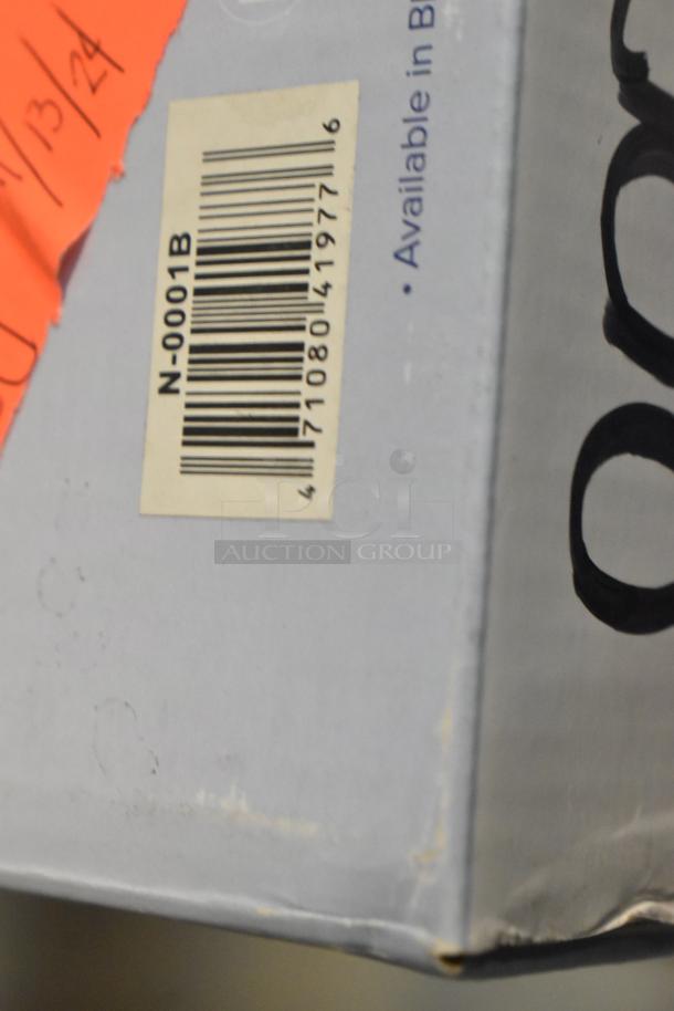 Barcoded box containing new kitchen items including bristle pastry brush, steam table covers, and Vollrath pan bands.