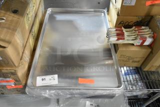 13 brand new Winco ALXP-1826 full-size metal baking pans, stacked, in pristine condition, labeled for auction.
