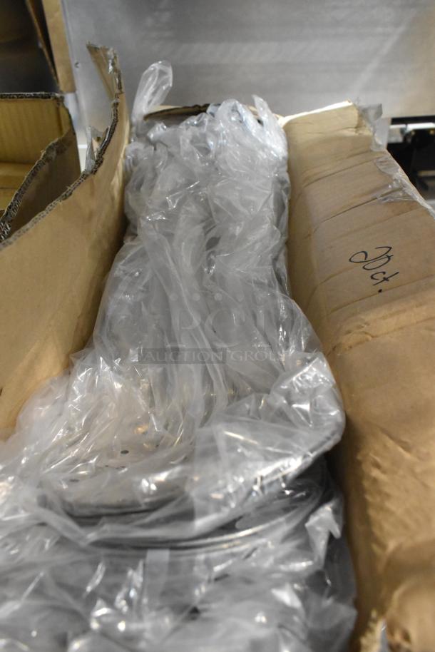 Three unopened boxes containing 10 Admiral Craft HDSK-6, 6-1/4" heavy-duty stainless steel perforated skimmers in packaging.