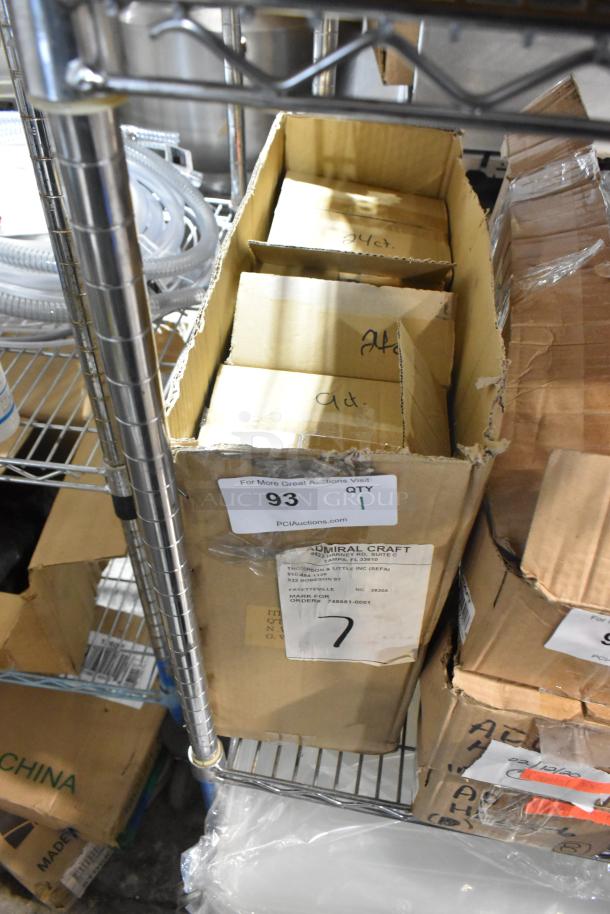 Box of brand new Adcraft VP-6/B vegetable peelers, unopened. Visible label includes order details and quantity.