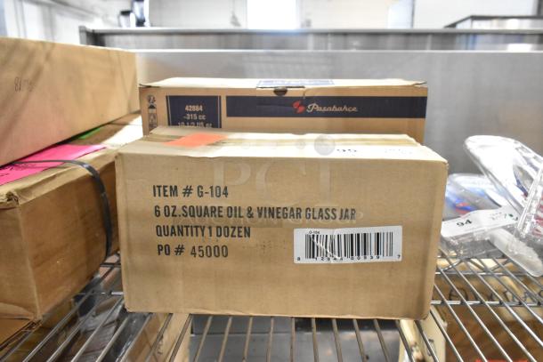 Brand new Winco G-104 6 oz oil & vinegar cruet box with visible label, includes dozen pieces.