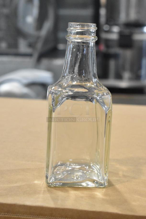 Brand new Winco G-104 oil & vinegar cruet, 6 oz capacity, clear glass, square shape.