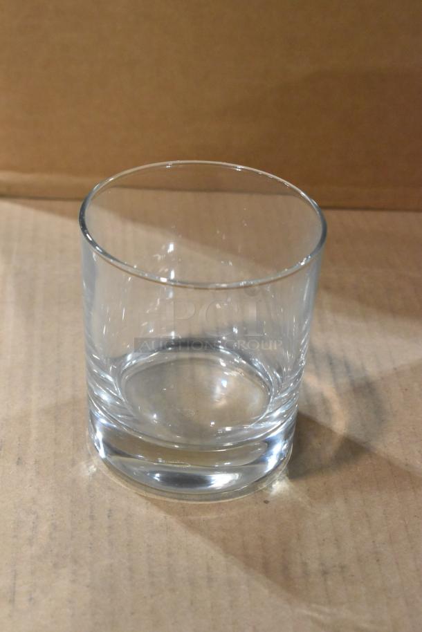 Three brand new items including a Steelite P42884 11.5 oz Pasabahce double old fashioned glass on a cardboard surface.
