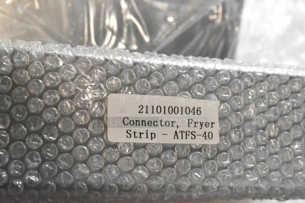 New Connector Fryer Strip ATFS-40 wrapped in bubble wrap; label reads "21101001046 Connector, Fryer Strip - ATFS-40".