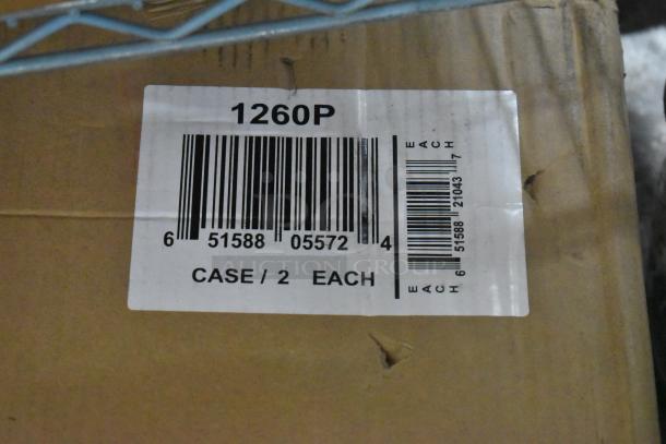 Box containing two Quantum Food 1260P epoxy-coated wire shelves, 60"W x 12"D, brand new with visible label showing model and barcode.