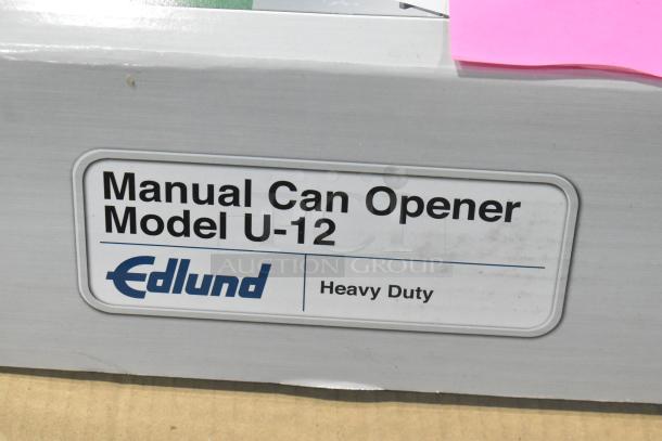 Brand new Edlund U-12 manual can opener, heavy-duty, with packaging label showing model and brand name.