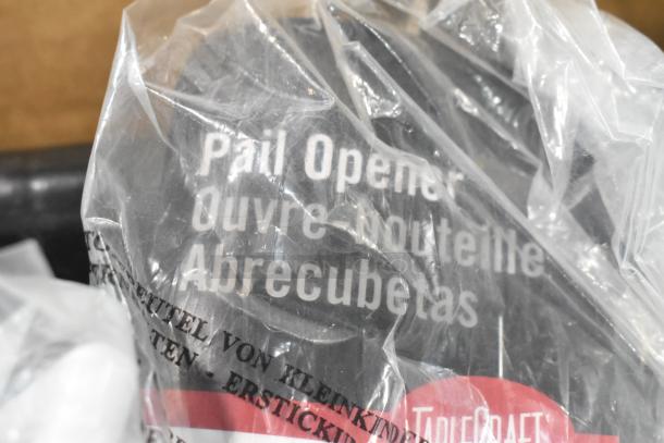 Clear plastic-wrapped pail opener marked "TableCraft" with multilingual text. Part of 12 new items set, including funnels and gloves.