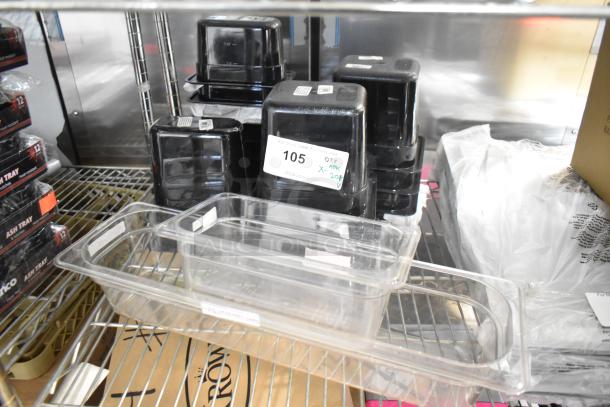 Brand new clear and black poly drop-in bins on metal shelf, 20 pieces. Includes item tag labeled "105" and "20X".