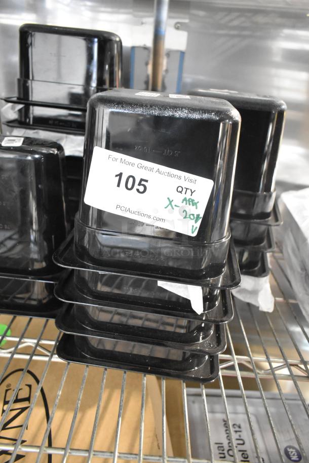 Stack of brand new clear and black poly drop-in bins on a metal shelf, labeled with auction number 105, quantity mark indicating 20 items.