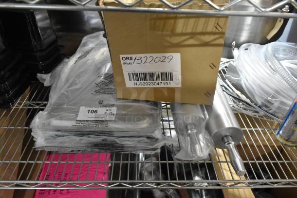 15 brand new items, including stainless steel drop-in bin lids and rolling pins, on metal shelf. Item tag: OR#1322029, NJ92023047191.