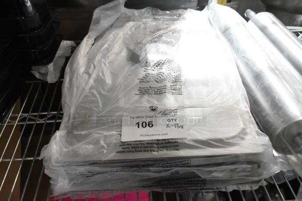 Stack of brand new stainless steel drop-in bin lids and rolling pins on a metal shelf, labeled "106 QTY X-15 v."