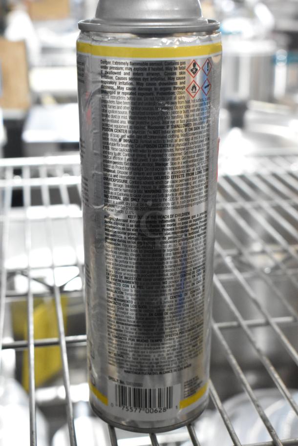 Sprayon Food Safe Grease aerosol can with detailed safety instructions and barcode, new condition on metal shelf.
