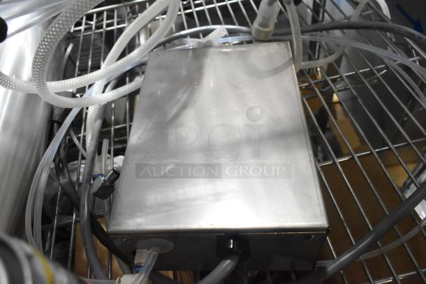 4 brand new items including Rinza Urnex tablets, Sprayon food safe grease, and a hose. Various tubes visible.