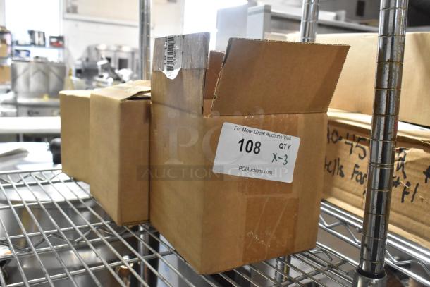 Three brand new items in a box labeled "108 QTY X-3" on a metal shelf, including TK-CBW set, unopened and in prime condition.