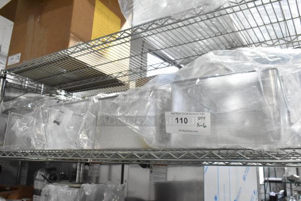 Six brand new deep frying baskets, model 60.75.391, wrapped in plastic on a metal shelf. Quantity tag indicates "x6".