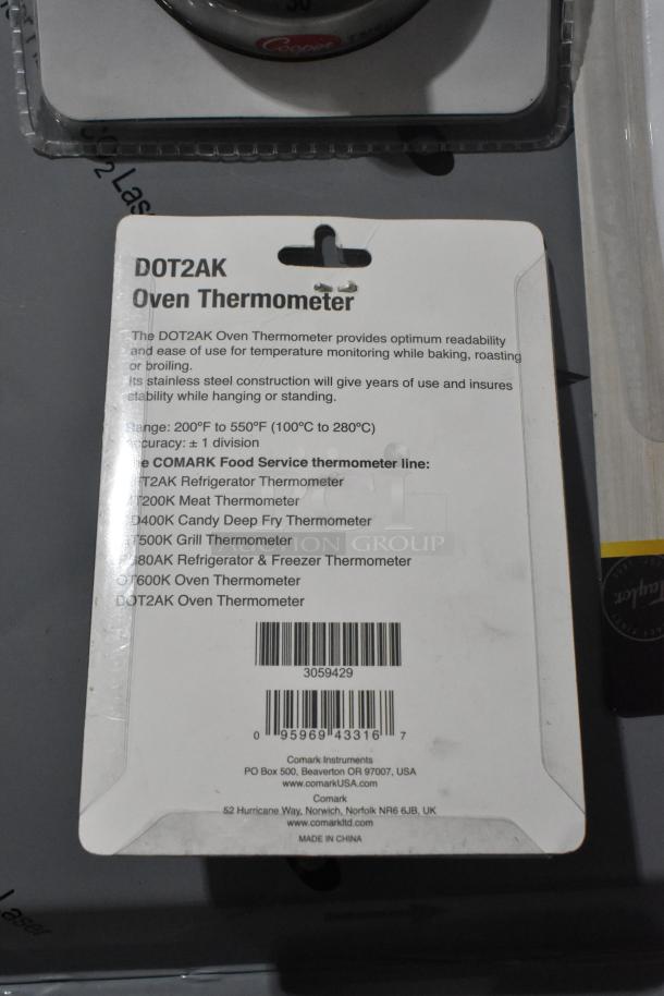 Pack of 57 new DOT2AK Oven Thermometers. Stainless steel construction, 200°F-550°F range, by Comark Instruments.