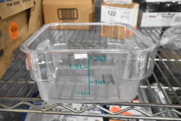 Clear poly container with measurement markings up to 2 qt/1.5 L, new condition, on a metal shelf.