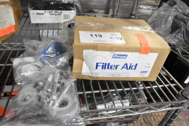 Pitco Filter Aid box with related sealed hardware, labeled new. Auction tag indicates lot 119.