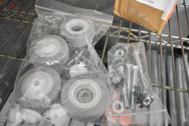 Three brand new Pitco Filter Aid pieces in clear plastic bags. Includes wheels, screws, and washers. Auction for 3 sets.