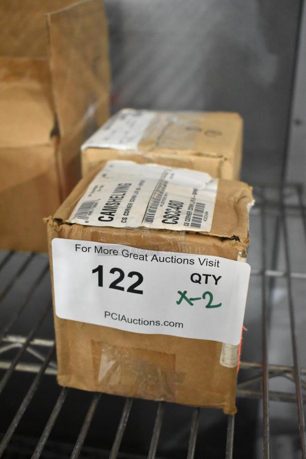 Two brand new Camshelving corner connectors in boxes, labeled for auction lot 122, quantity x2.