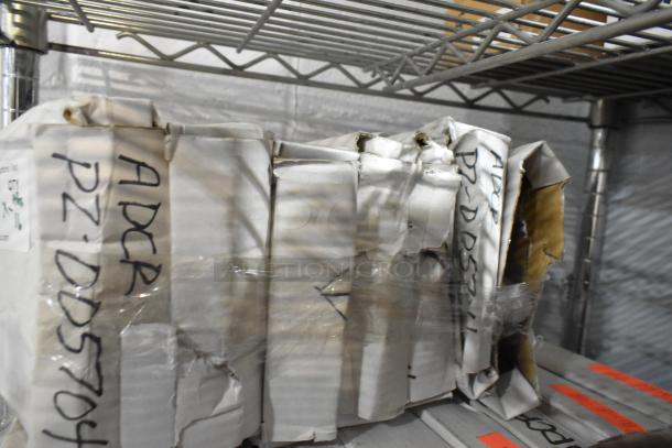 16 brand new dough dockers in original packaging, visible markings "ADCR PZ-DD5704," indicating model or inventory code.