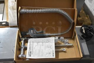 Brand new Krowne spray faucet nozzle with flexible hose and fittings. Includes installation guide in original packaging.