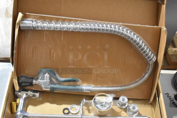 Brand new Krowne spray faucet nozzle with flexible stainless steel hose, polished chrome finish, in original packaging.