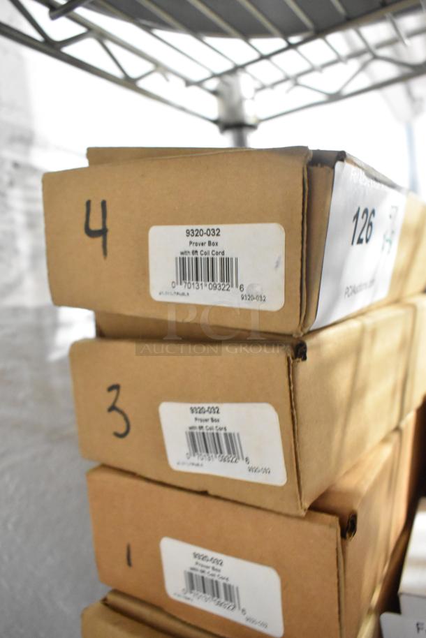 Set of five brand new Cooper Atkins Prover 9320 boxes with 6 ft coil cord, labeled 9320-032, stacked on a shelf.