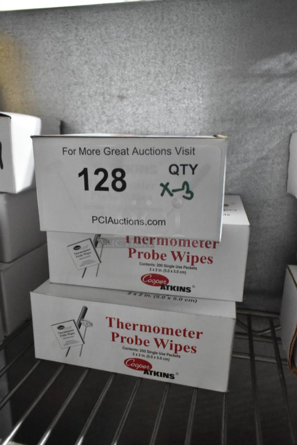 Three boxes of brand new Cooper Atkins Thermometer Probe Wipes, 200 single-use packets each, on wire shelf.