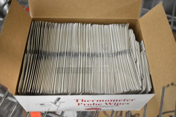 Box of thermometer probe wipes, brand new, unopened. Contains individually packed wipes, labeled for thermometer sanitation.