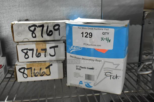 Four brand new boxes, including Ateco decorating bags and Taylor labels, labeled for auction with item codes 8769, 8767J, and 8766J.