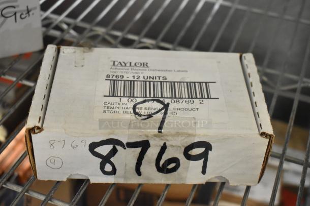 Box of Taylor adhesive backed dishwasher labels, 8769 model, 12 units, brand new, temperature sensitive, on shelf.