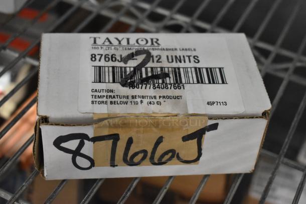 Box of Taylor temperature-sensitive dishwasher labels, model 8766J, 12 units, new condition. Caution for storage below 110°F.