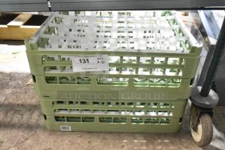 Brand new poly dish caddies, set of two, in mint condition. Includes auction label "131, QTY x 2," from PCI Auctions.