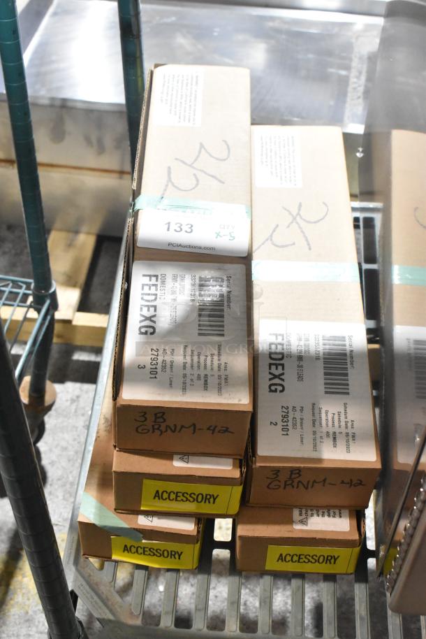 5 brand new Hatco GRNM-42 infrared strip heaters in boxes. Labels show model numbers and auction info.