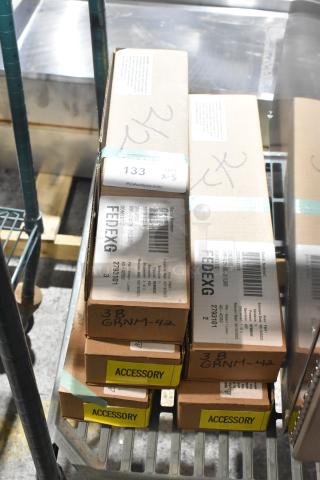 5 brand new Hatco GRNM-42 infrared strip heaters in boxes. Labels show model numbers and auction info.