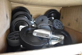 Box of new Metro 5M swivel casters, black finish, featuring metal stems. Includes two items, twice your bid value.
