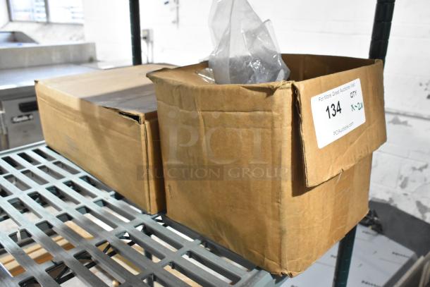 Two brand new items, including a Metro 5M swivel caster, in unopened boxes on a metal shelf, with auction label "Qty 2x" visible.