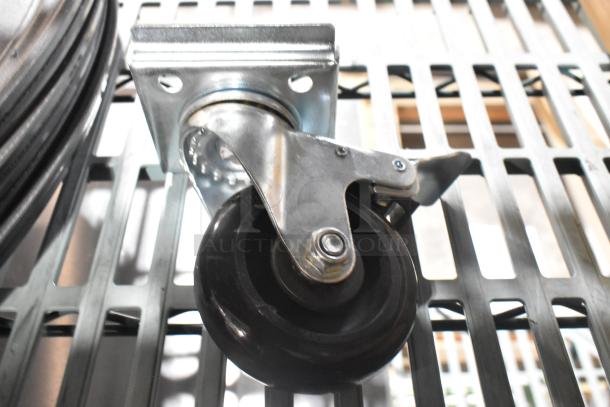 Brand new Metro 5M swivel caster on a metal surface, featuring a black wheel and metal frame. Two items available.