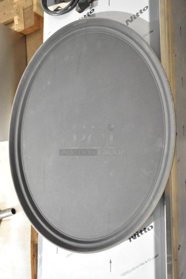 Brand new Update GT-2700BK black oval serving tray shown. Durable, sleek design, ideal for catering. Quantity: 7.