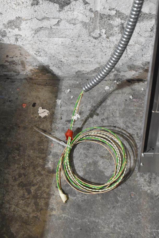 Four new Hatco GRNM-42 Glo-Ray Narrow Max infrared strip heaters with attached installation cables.