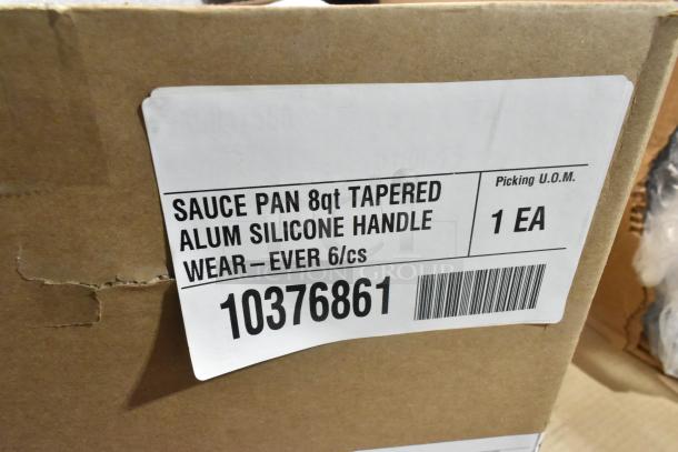 Box of 6 new Wear-Ever 10376861 metal skillets and 6 Vollrath 382170 7 qt sauce pans with label showing item details.