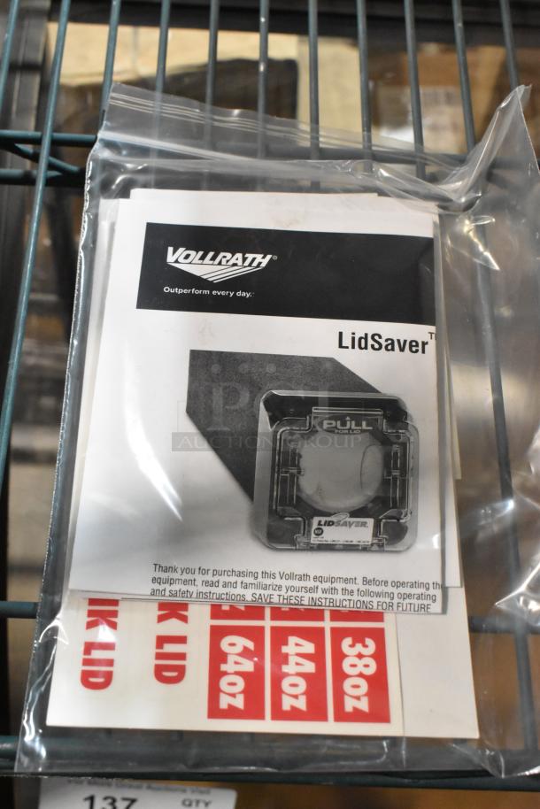 Brand new Vollrath C1-L-VS LidSaver in packaging. Includes instruction manual and size labels.