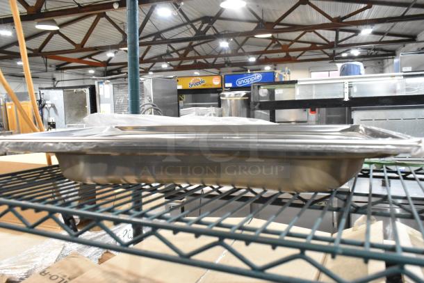 Brand new Steelite DW64RFP2 round chafer food pan on a metal rack in a warehouse setting, stainless steel, auction lot of 4.