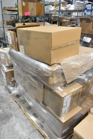 Pallet with cardboard boxes containing 24 brand new items including 1009VL, 10054596 teaspoons, Steelite teaspoons, Camwear 10312893 tumblers. Pallet wrapped in clear plastic for shipping, labels visible with item codes.