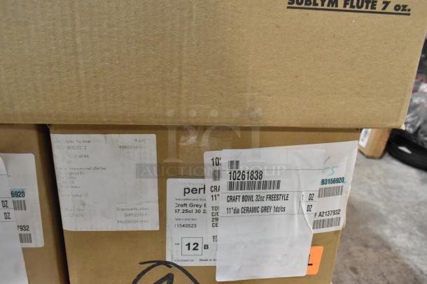 Cardboard boxes labeled "Craft Bowl 32oz Freestyle, 11-inch Ceramic Grey" and other items, new condition for auction.