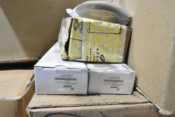 Boxes of 47 new items including Lucia table knives, bowls, shampoo, mugs, and paper bags, labeled with model numbers.