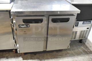 2018 Leader ESLB36SC stainless steel 2-door undercounter cooler on casters, 115 volts, 1 phase, visible brand label.