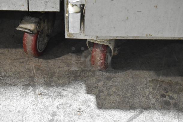 2018 Leader ESLB36SC stainless steel 2-door undercounter cooler on commercial casters, visible wheels, used condition.